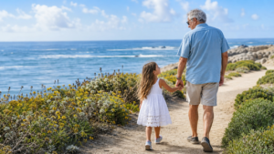 old man and young granddaughter walking image